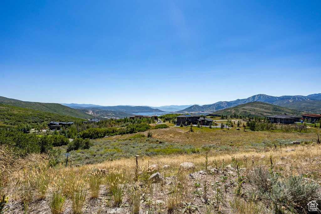 View of mountain backdrop featuring rural landscape