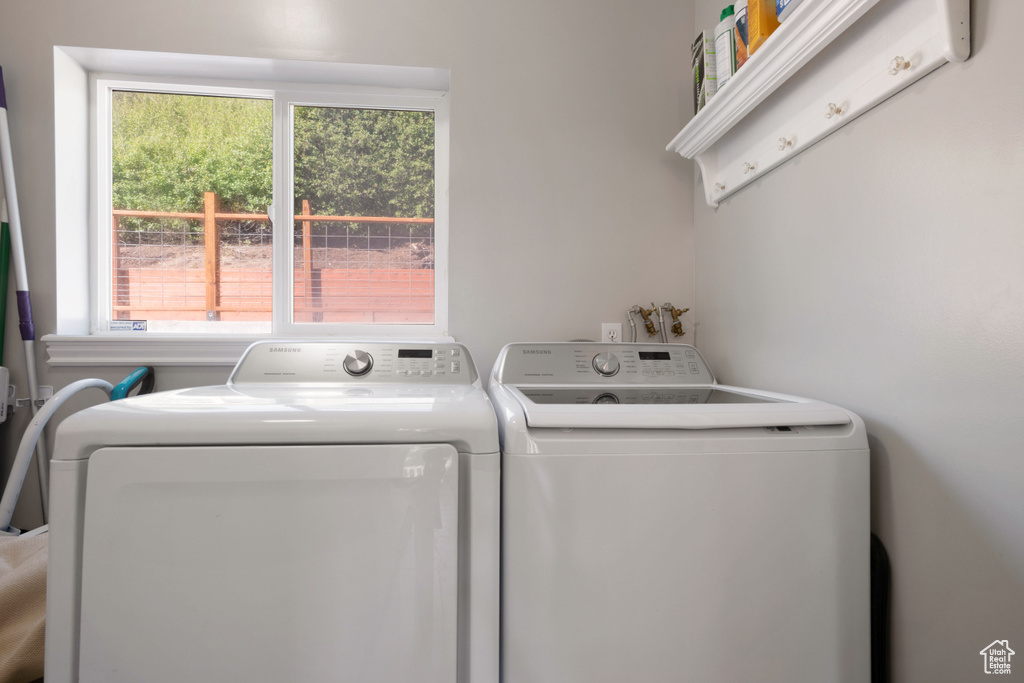 Laundry area with washer and clothes dryer
