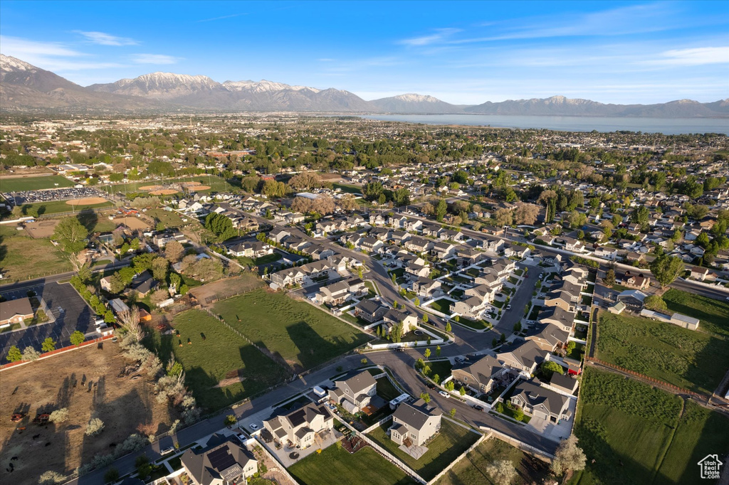 View of property location with mountains and nearby suburban area