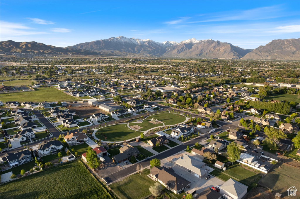 Aerial overview of property\'s location with a mountain backdrop and nearby suburban area