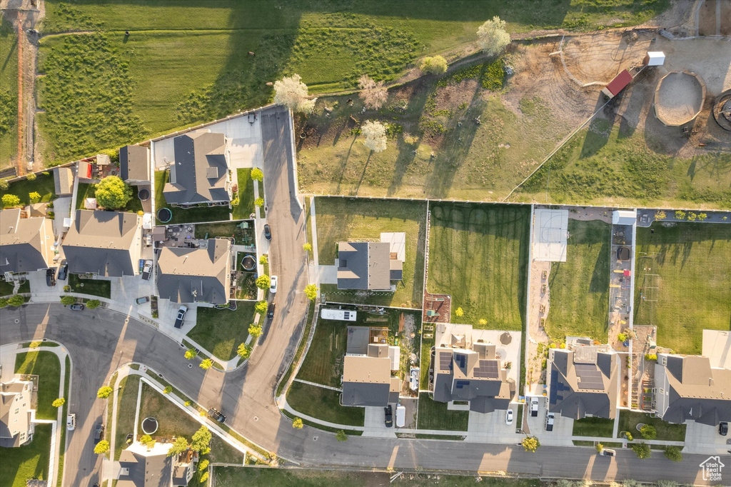 Aerial view of property\'s location featuring nearby suburban area