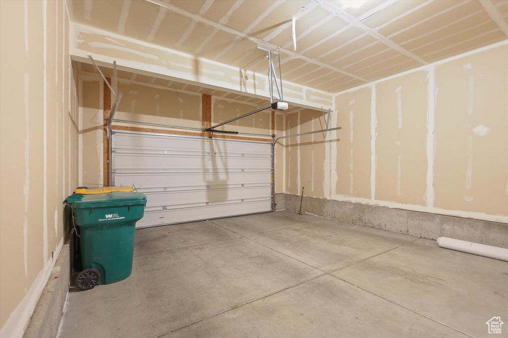 Garage featuring a garage door opener