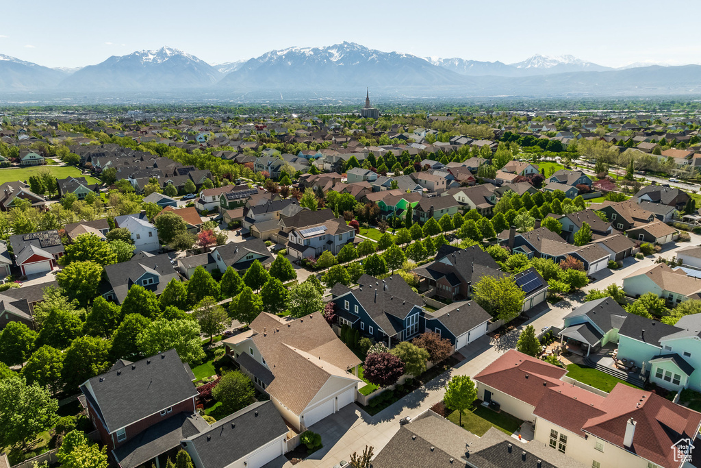 Aerial perspective of suburban area featuring a mountainous background