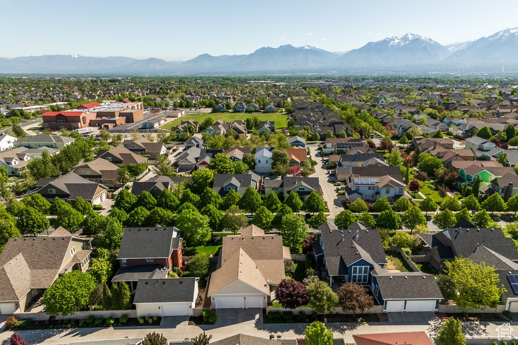 Aerial view of residential area featuring a mountainous background
