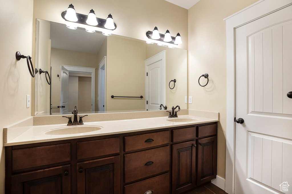 Bathroom featuring double vanity