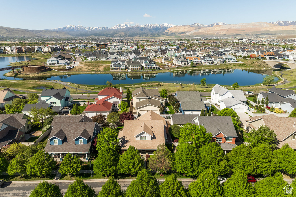 Aerial view of residential area featuring a water and mountain view