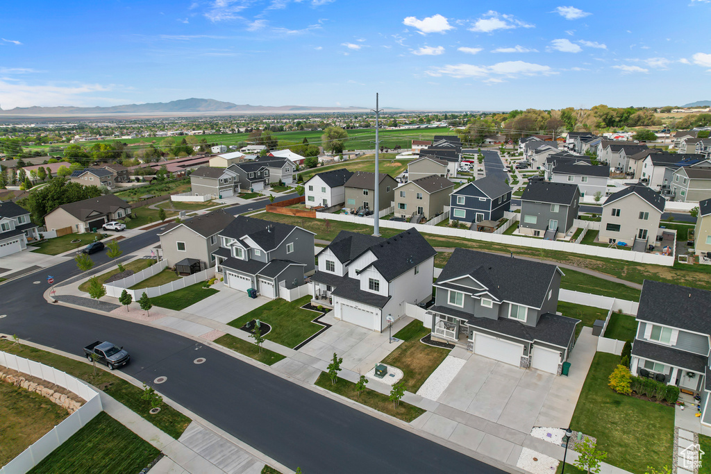 Aerial perspective of suburban area with a mountainous background