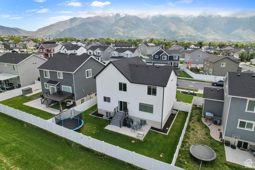 Aerial view of residential area with a mountain backdrop