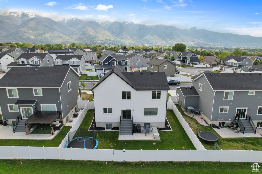 Aerial view of residential area featuring mountains
