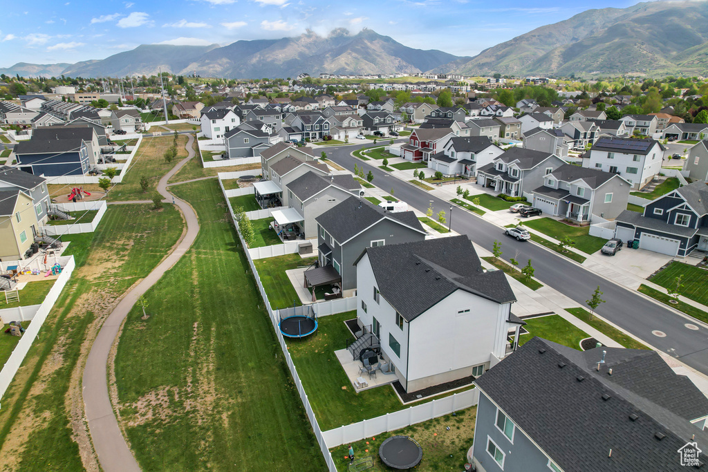 Aerial view of residential area featuring a mountain backdrop