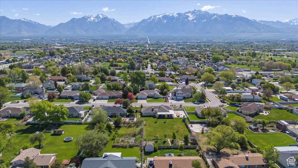 Aerial perspective of suburban area with a mountain backdrop