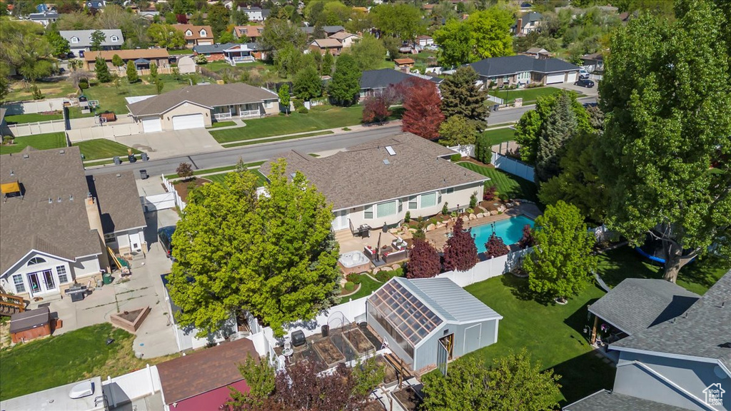 Aerial view of residential area featuring a pool