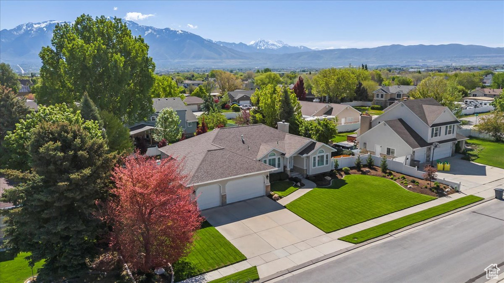 Aerial view of residential area featuring mountains