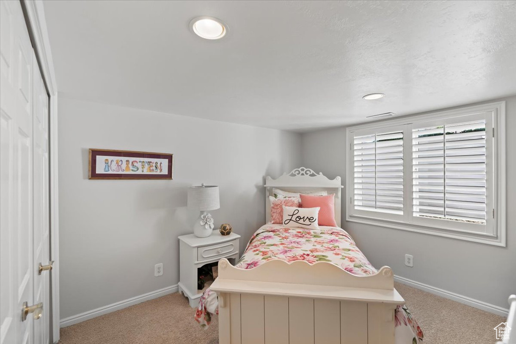 Carpeted bedroom with baseboards