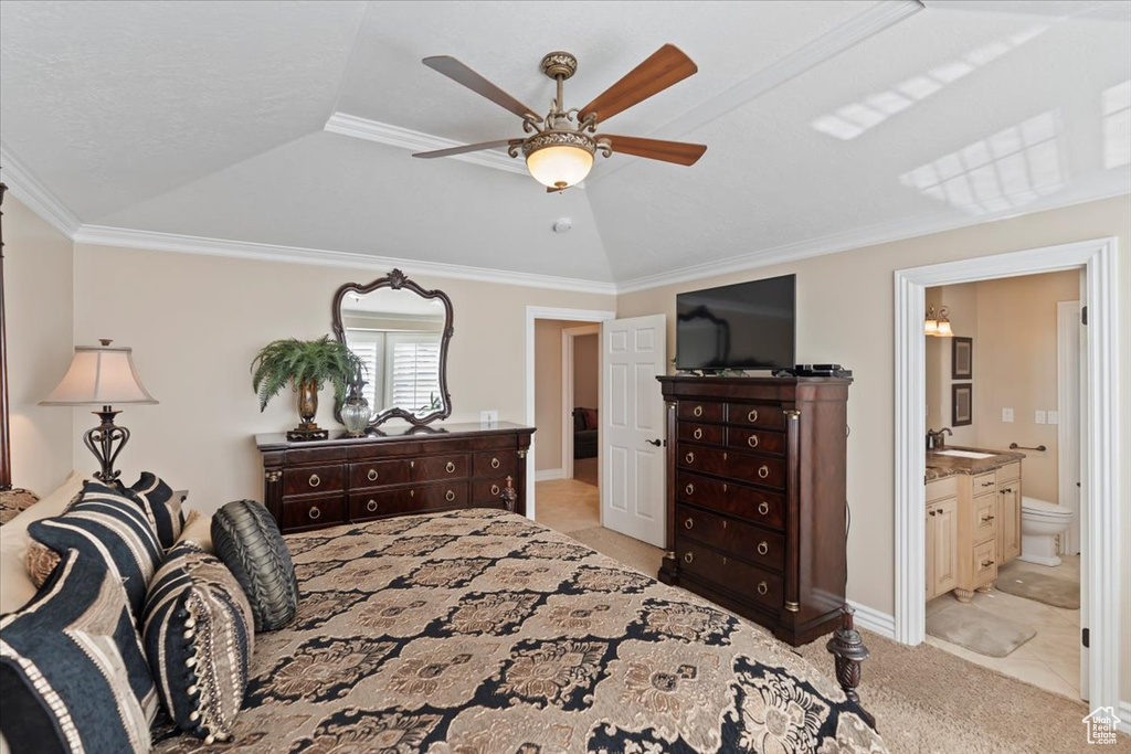Bedroom featuring a sink, light colored carpet, crown molding, ceiling fan, and connected bathroom