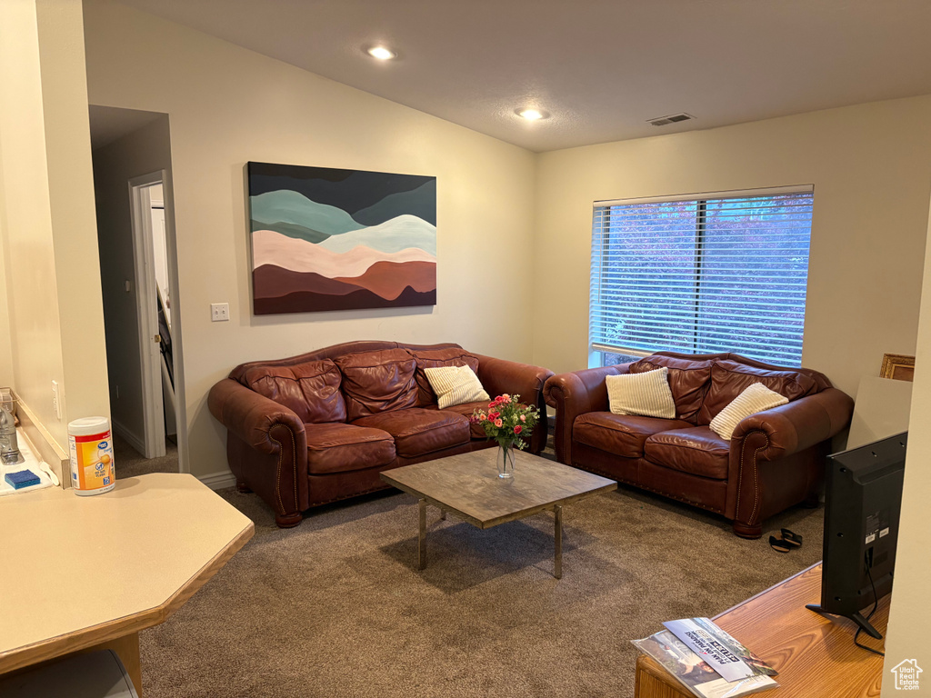 Living room with carpet flooring and recessed lighting