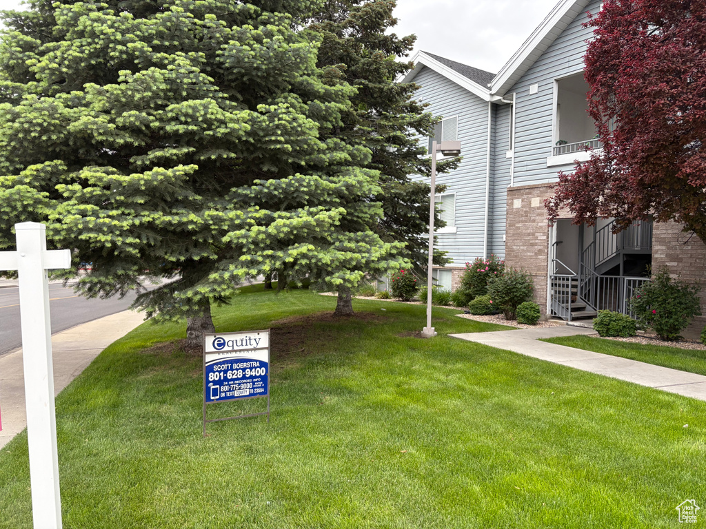 View of community with a yard