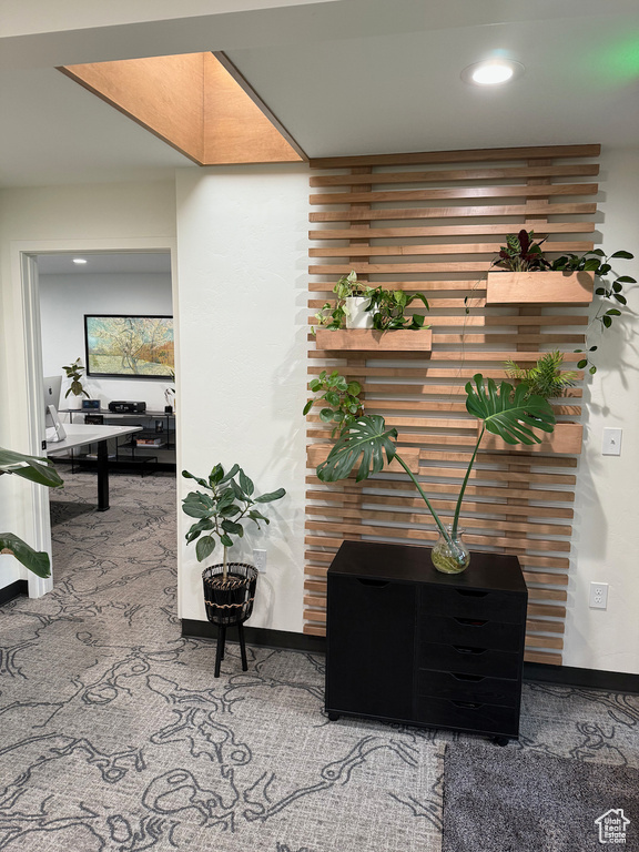 Corridor featuring baseboards, recessed lighting, and carpet floors