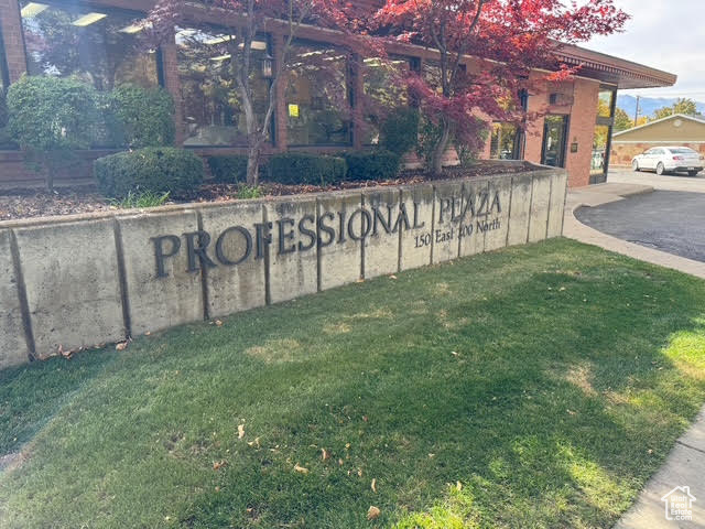 Community / neighborhood sign with a lawn