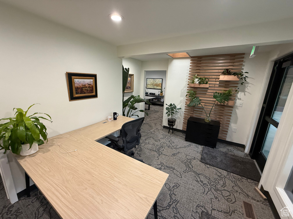 Office space with carpet flooring and recessed lighting