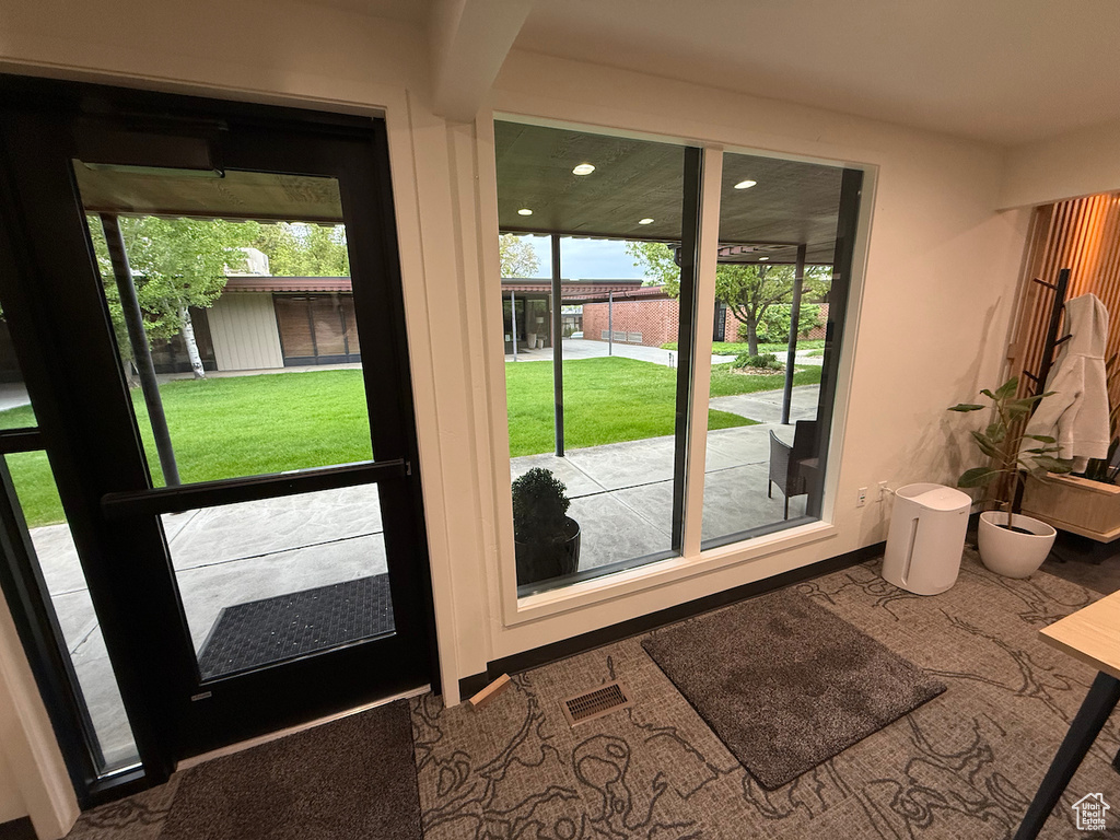 Doorway featuring recessed lighting