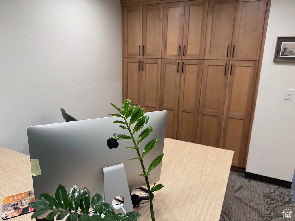 Home office featuring baseboards