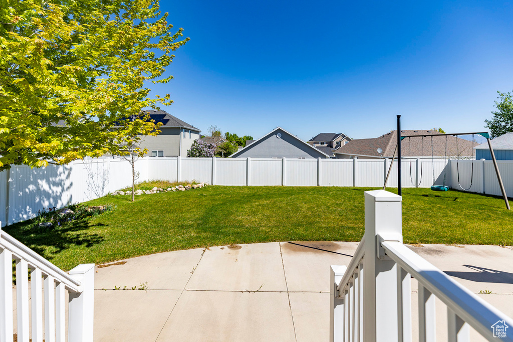 View of yard with a patio area, a residential view, and a playground