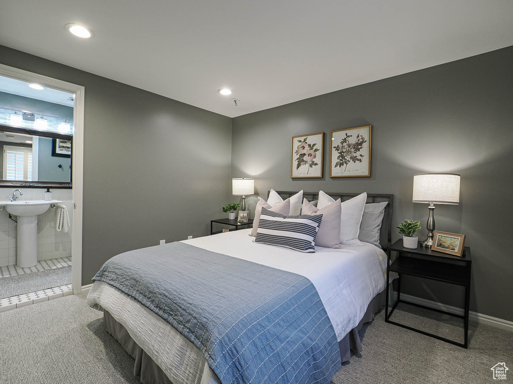 Carpeted bedroom featuring a sink, baseboards, connected bathroom, and recessed lighting