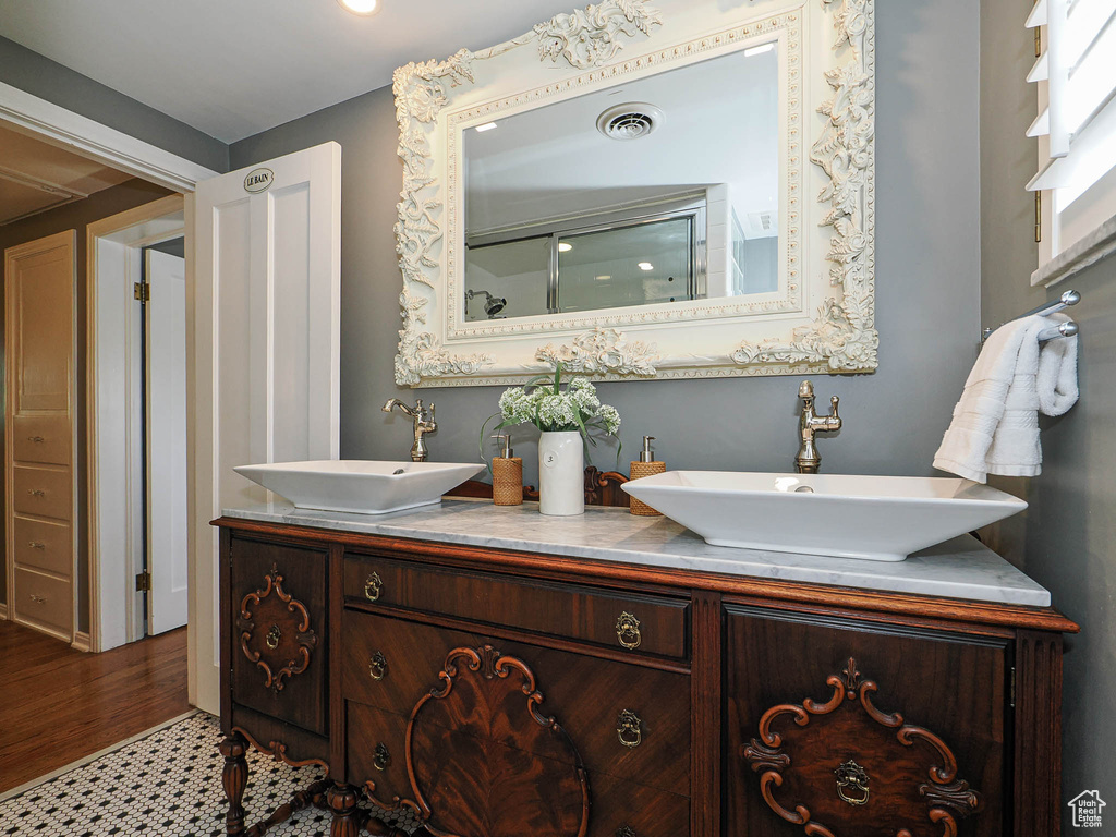 Full bathroom featuring double vanity