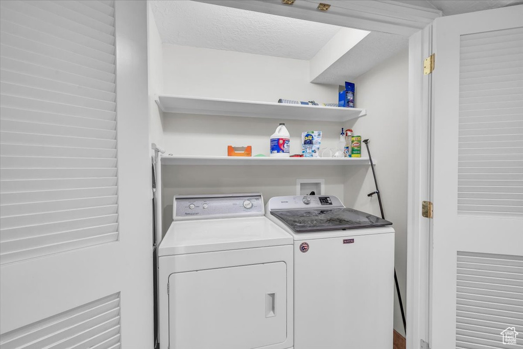Laundry area featuring washer and clothes dryer