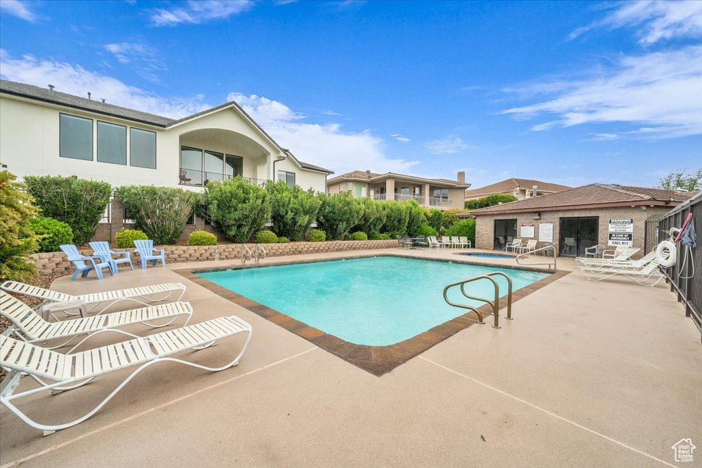 Community pool with a patio area