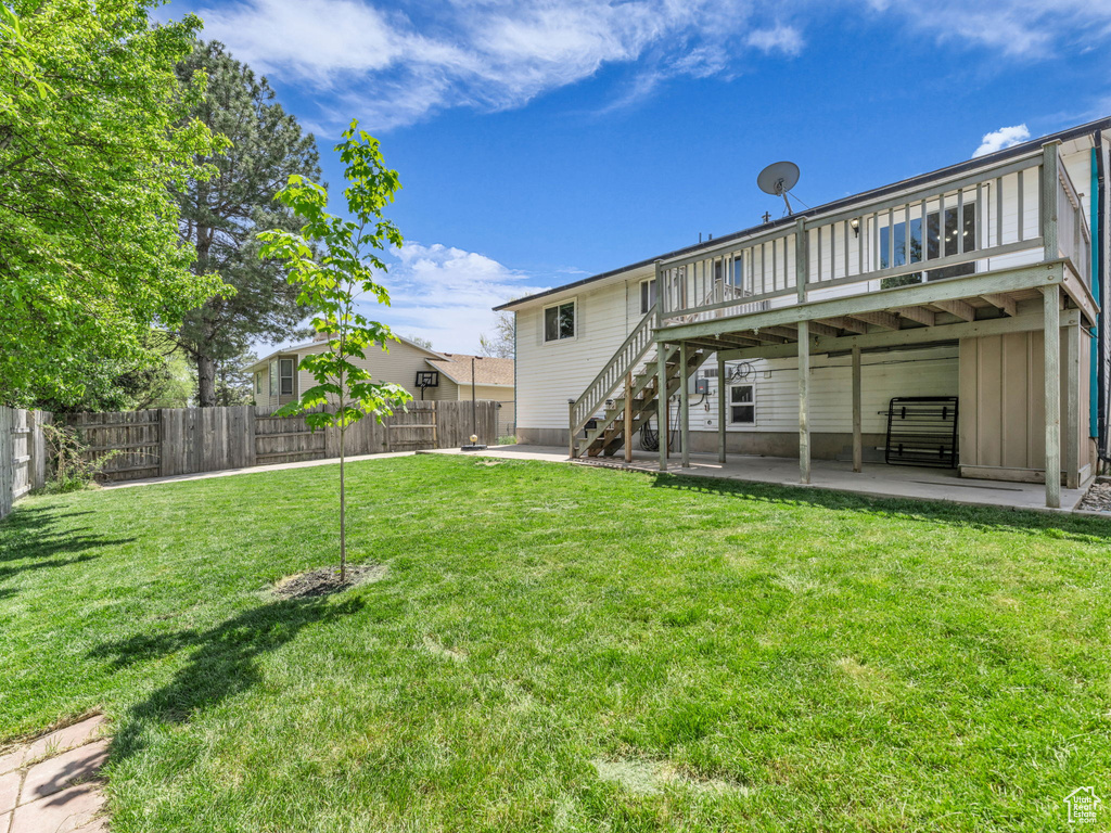 Back of property featuring a patio, a deck, and stairway