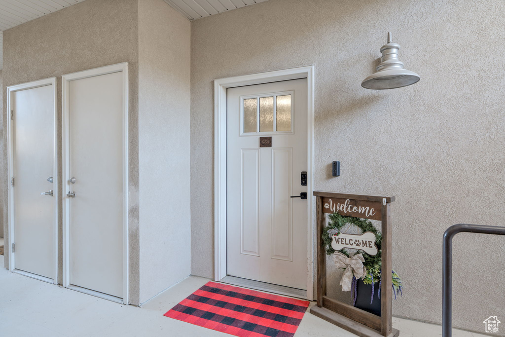 Property entrance with stucco siding