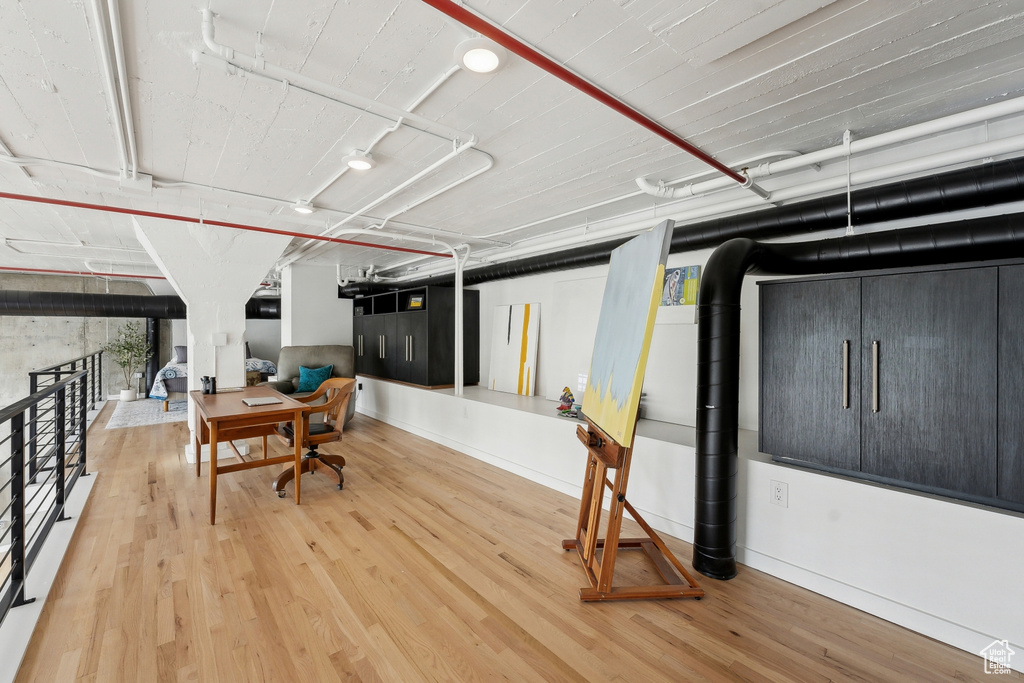Below grade area featuring wood finished floors