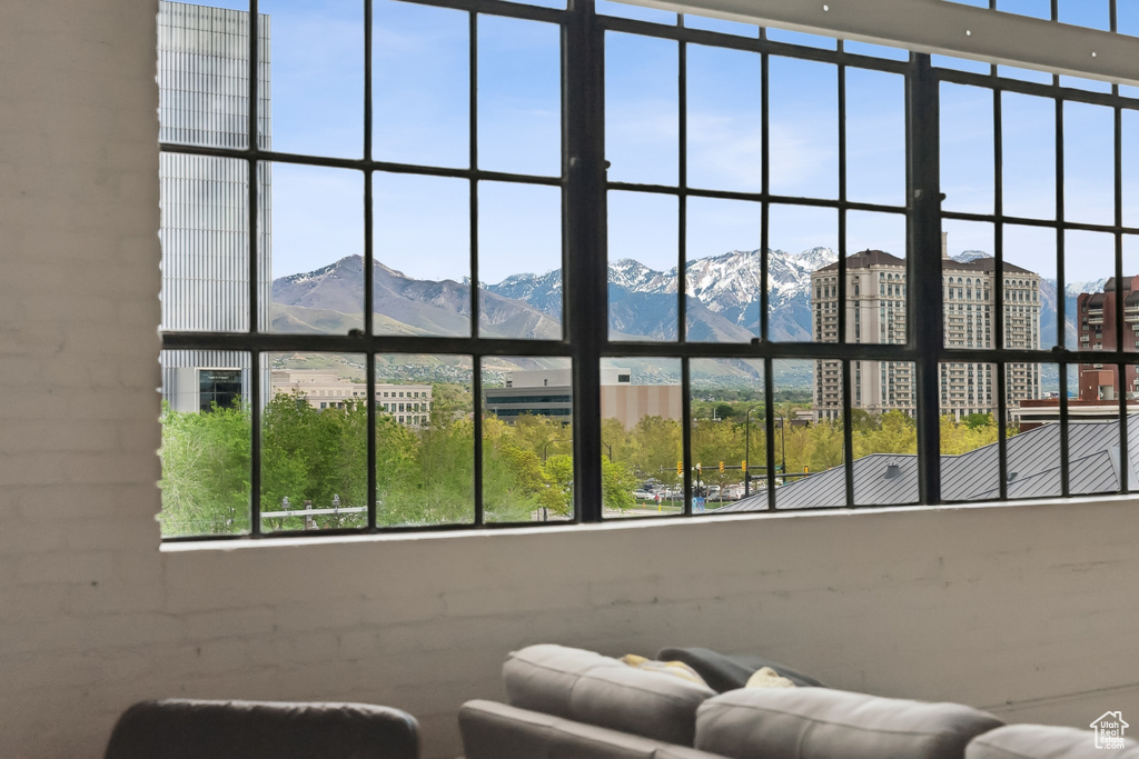 Living area with a mountain view and healthy amount of natural light
