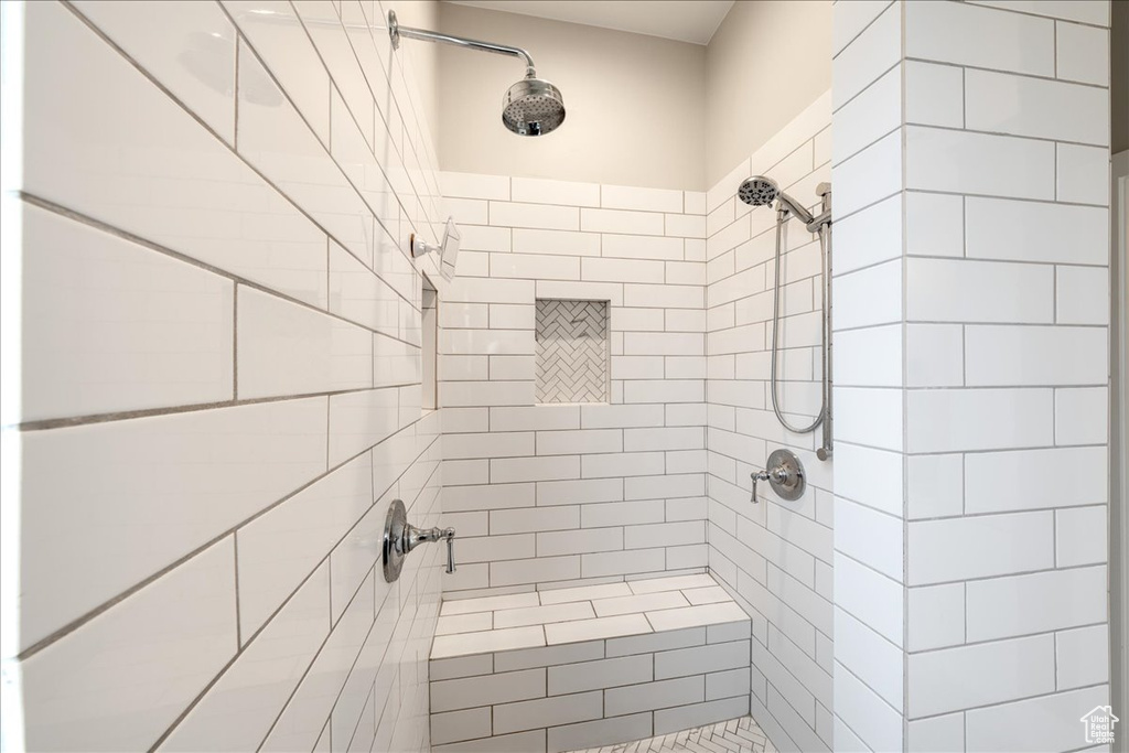 Full bathroom with a tile shower