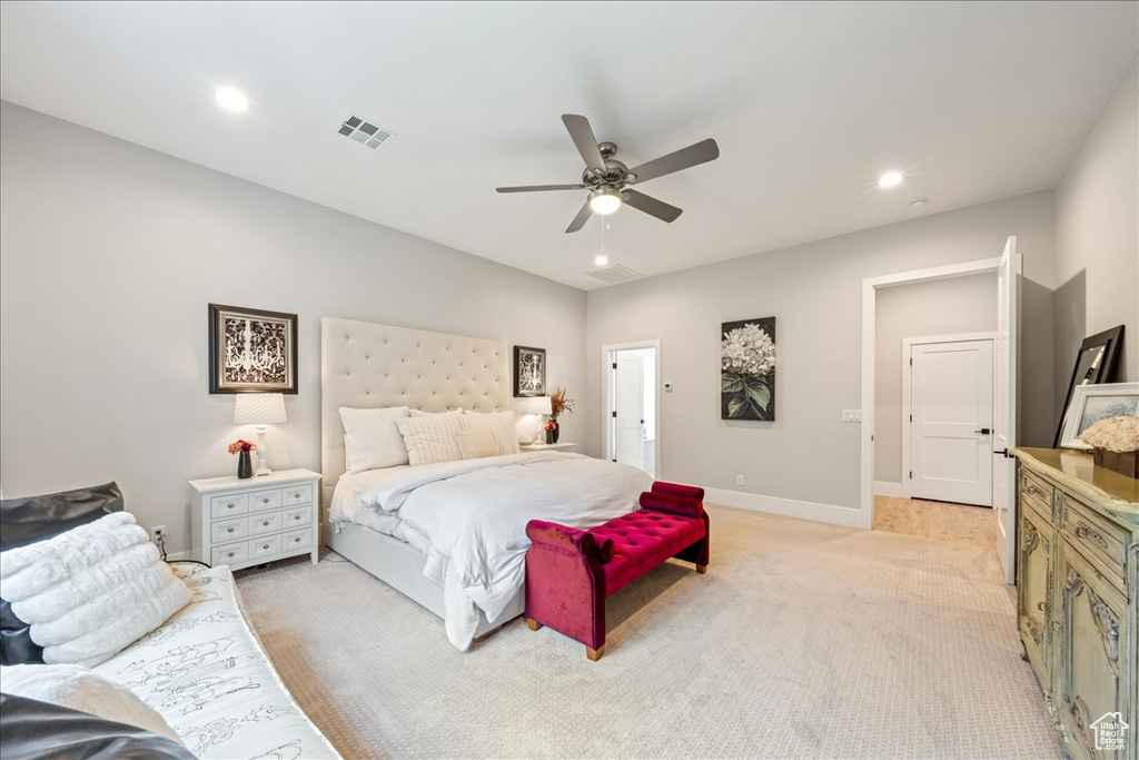 Bedroom featuring light colored carpet, baseboards, a ceiling fan, and recessed lighting