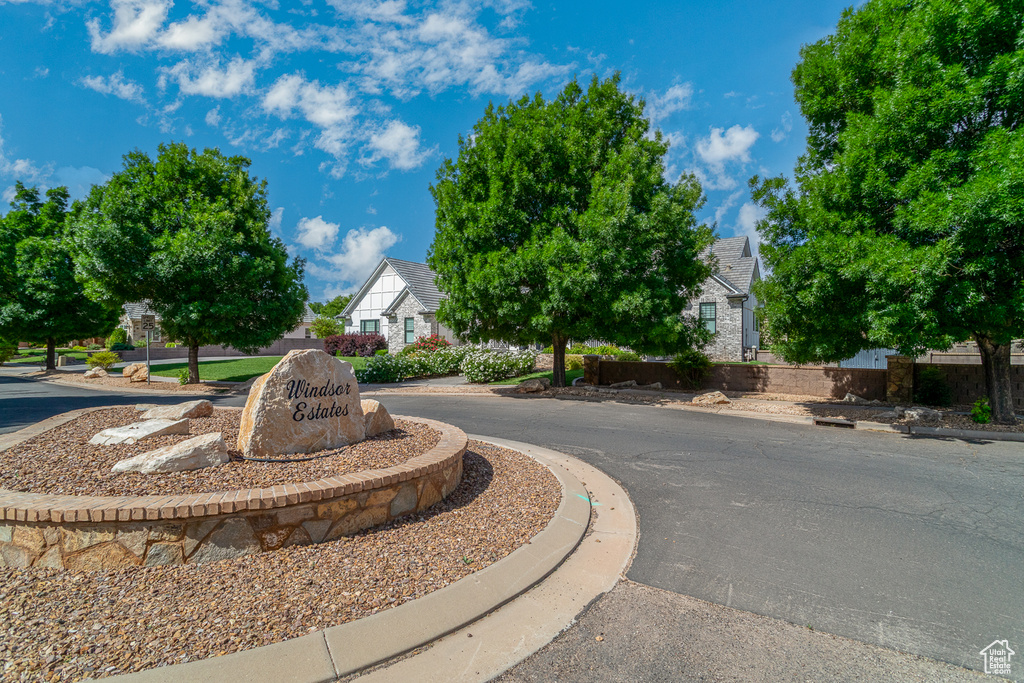 View of asphalt road featuring curbs