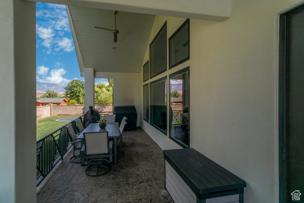 View of patio featuring outdoor dining area and fence