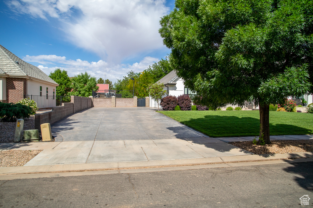 Obstructed view of property featuring a gate