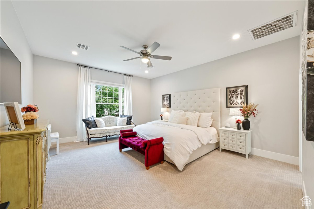 Bedroom with light colored carpet, baseboards, ceiling fan, and recessed lighting