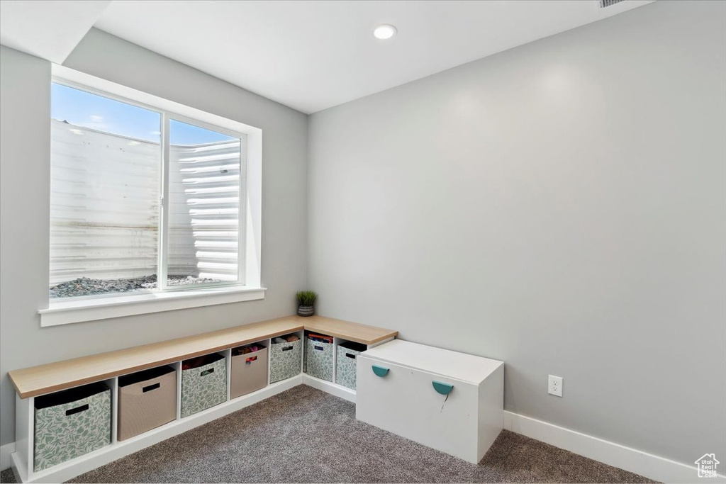 Unfurnished office with carpet flooring, plenty of natural light, baseboards, and recessed lighting