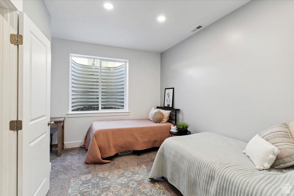 Carpeted bedroom featuring recessed lighting and baseboards