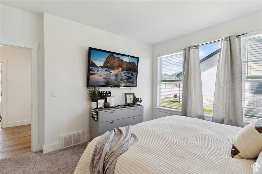Carpeted bedroom with baseboards
