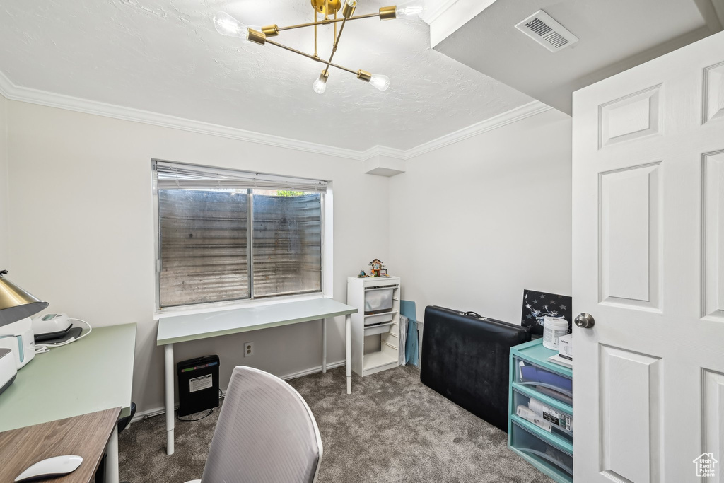 Carpeted office featuring crown molding, a chandelier, and baseboards