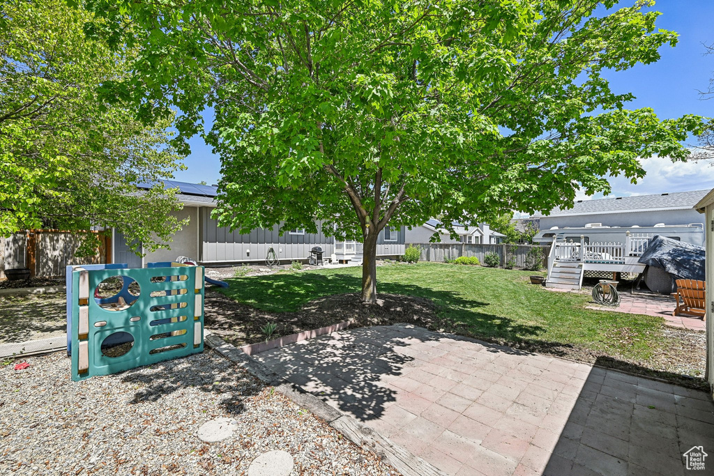 View of patio featuring a wooden deck