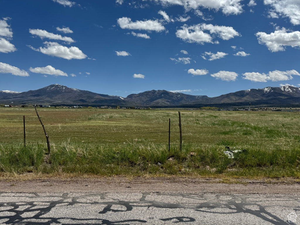 View of mountain backdrop featuring rural landscape