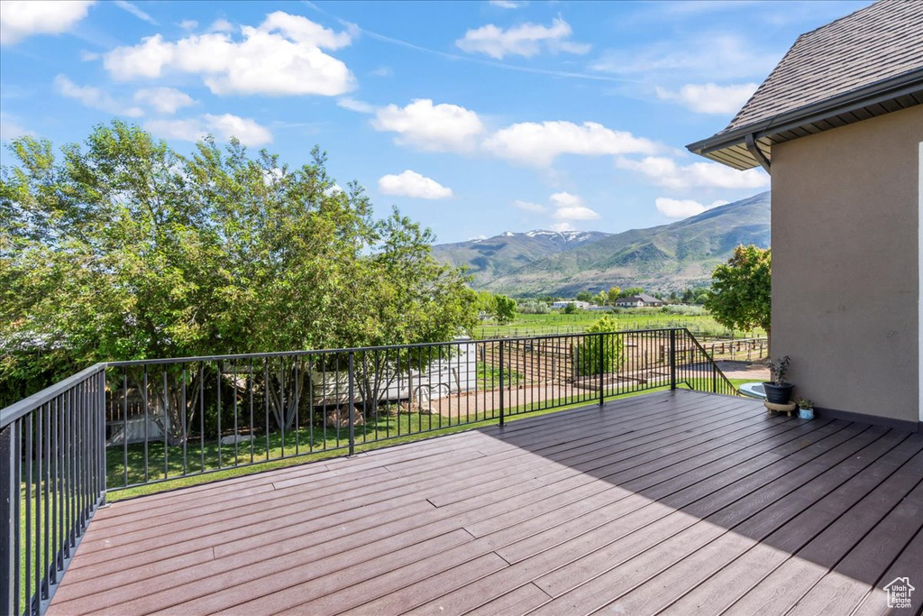 Wooden terrace featuring a mountain view