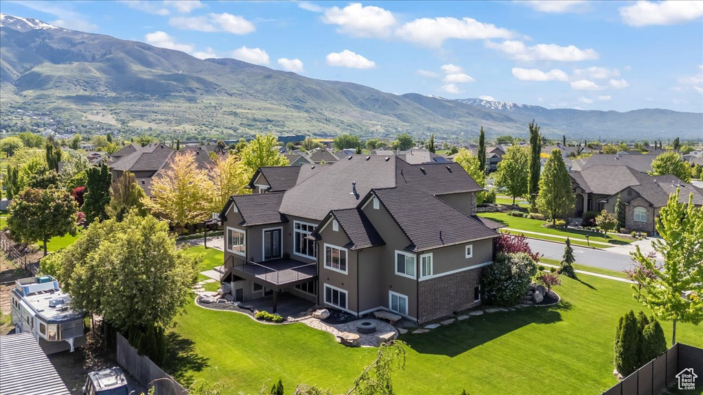 Aerial perspective of suburban area with a mountain backdrop