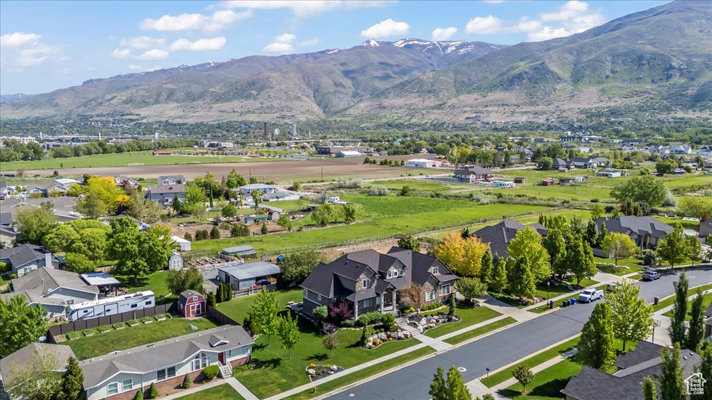 Aerial perspective of suburban area with a mountain backdrop